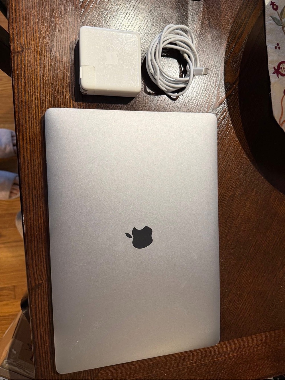 Apple Silver MacBook with White Charger and Cable
